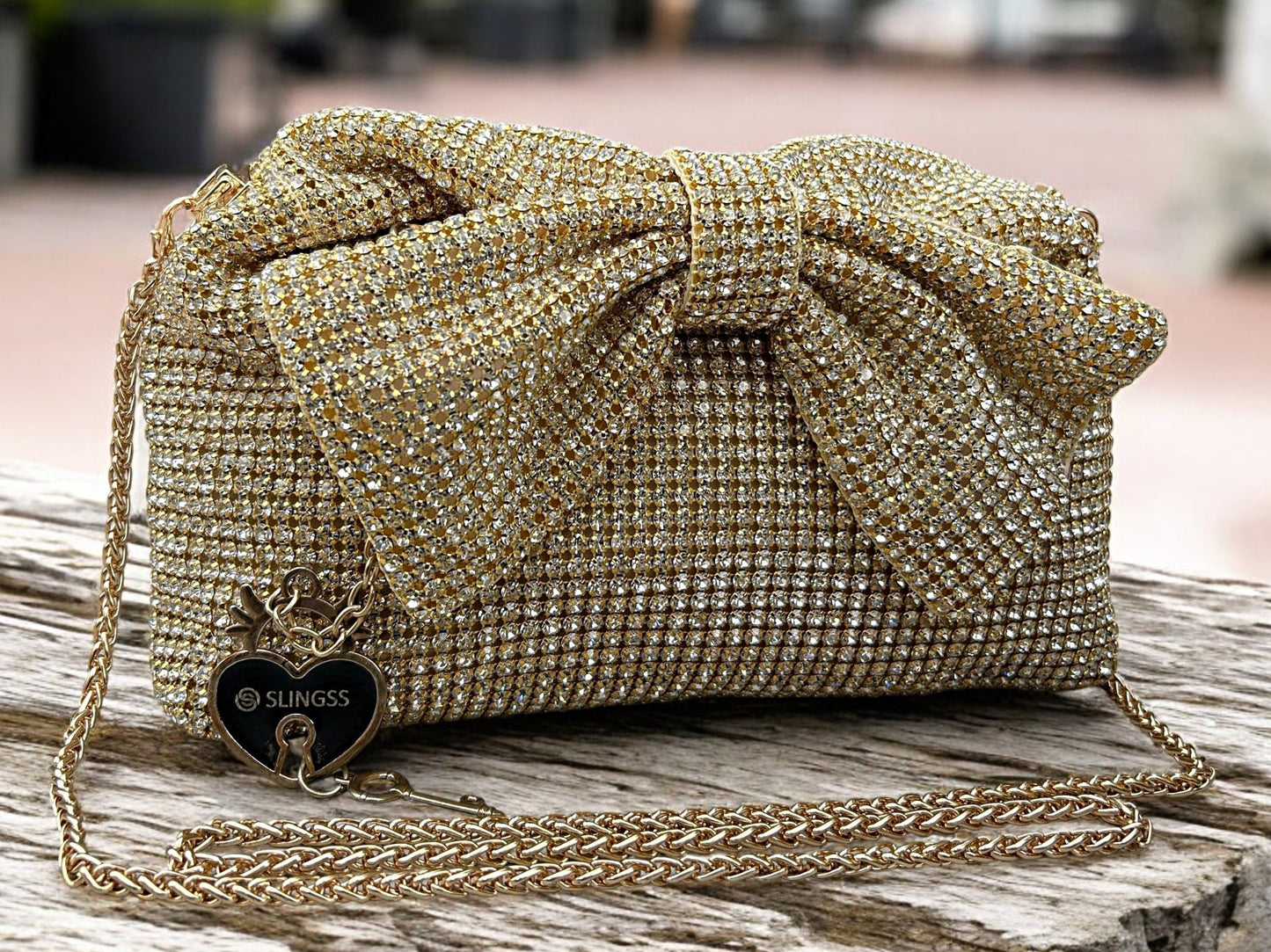 Slingss Luxury Range Exclusive Diamond Studded Partywear Bow Shaped Handle Bag For Ladies With Long Chain