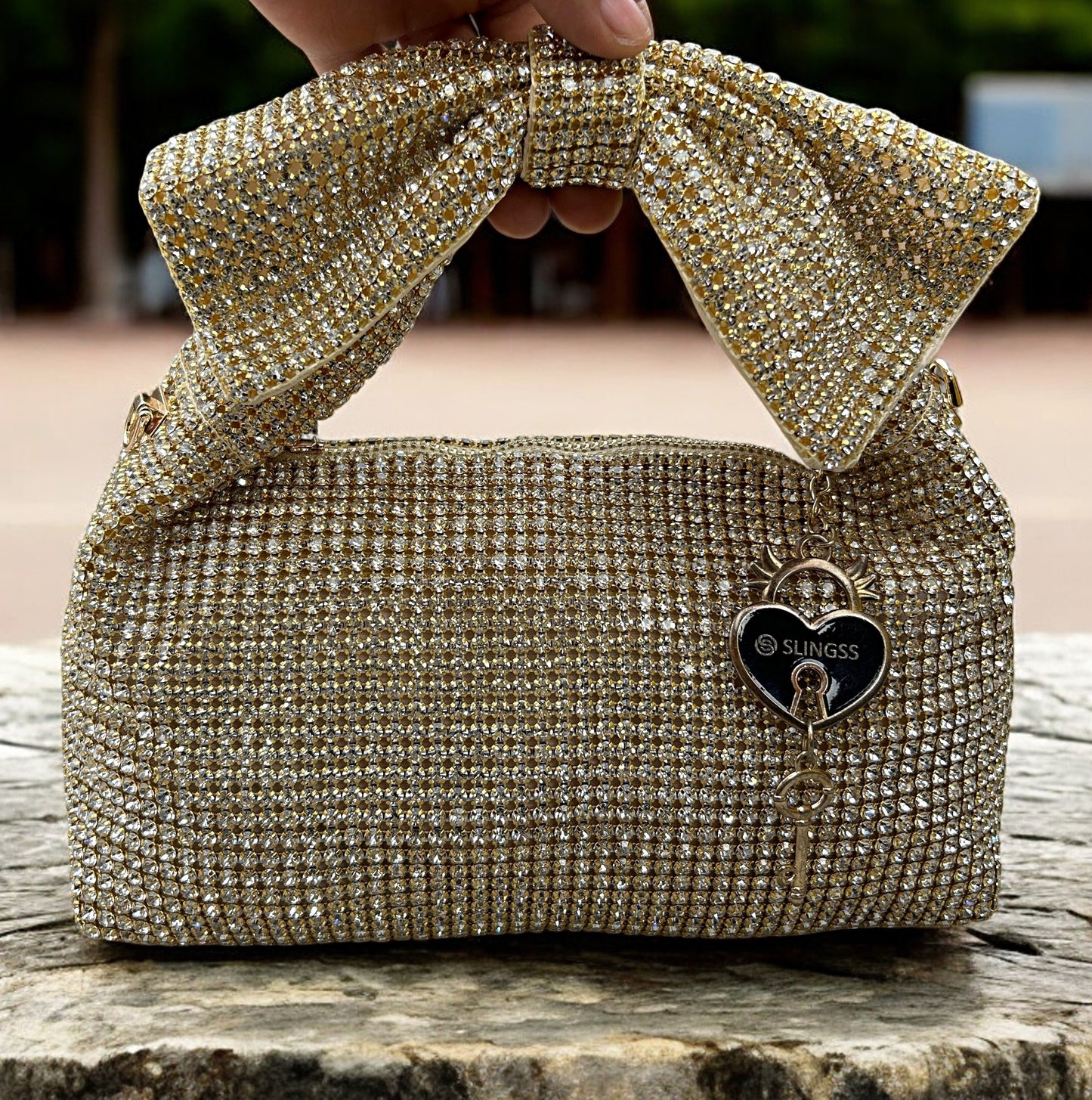Slingss Luxury Range Exclusive Diamond Studded Partywear Bow Shaped Handle Bag For Ladies With Long Chain